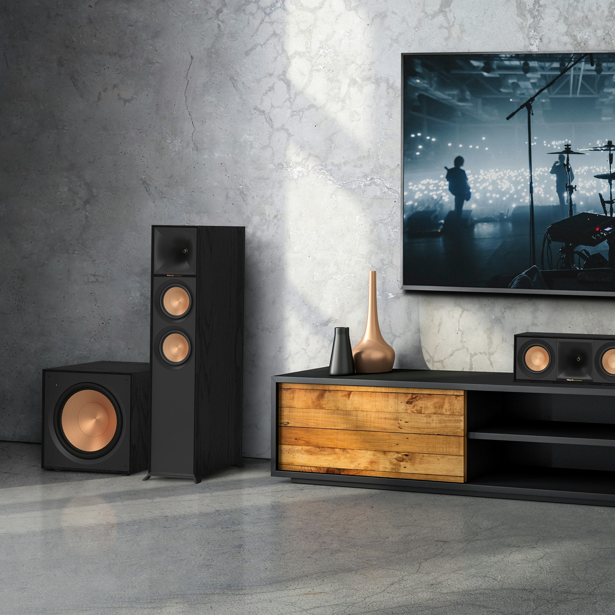 Reference Subwoofer R-121SW next to a Klipsch floorstanding speaker and center channel speaker